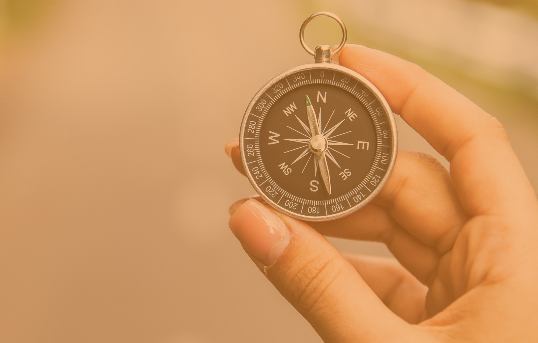 woman hand holding compass in road background